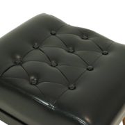 Pouf noir vintage pieds coniques style Chesterfield en skaï