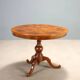 Antique round walnut table with a baluster central leg, Italy, 19th century.