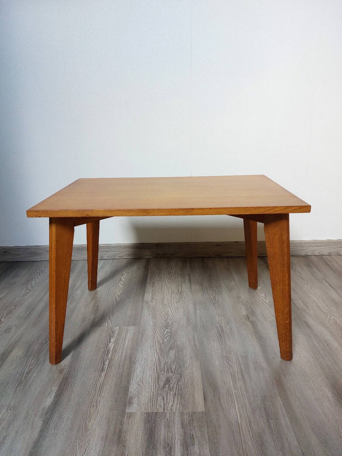 Coffee table with wooden compass legs