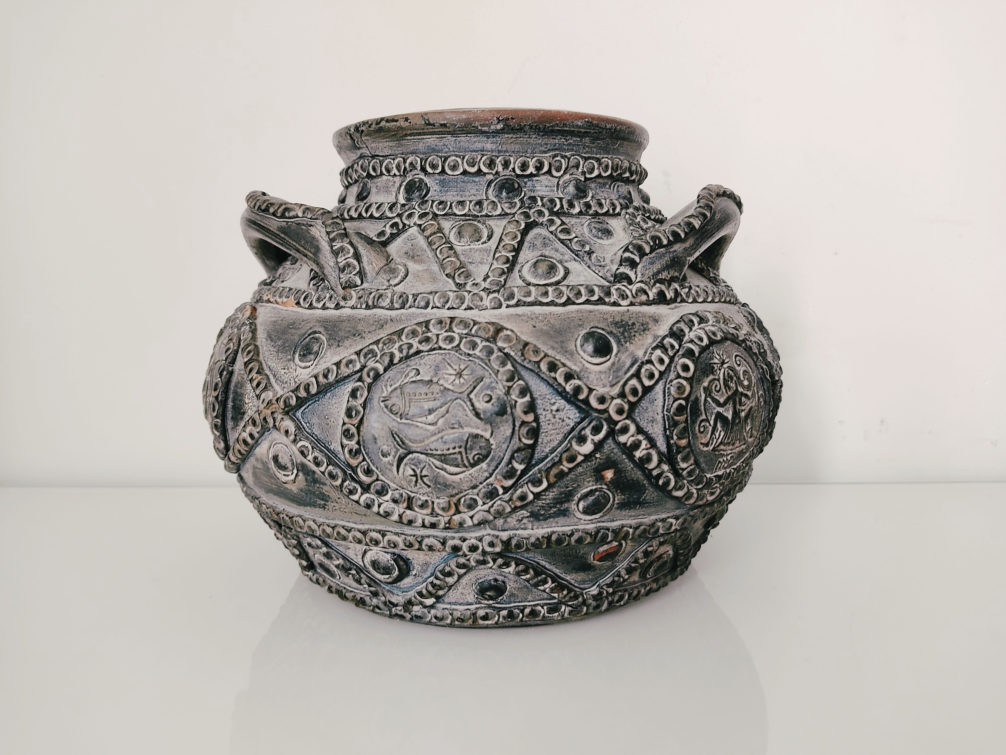 Terracotta vase with decoration astrological signs