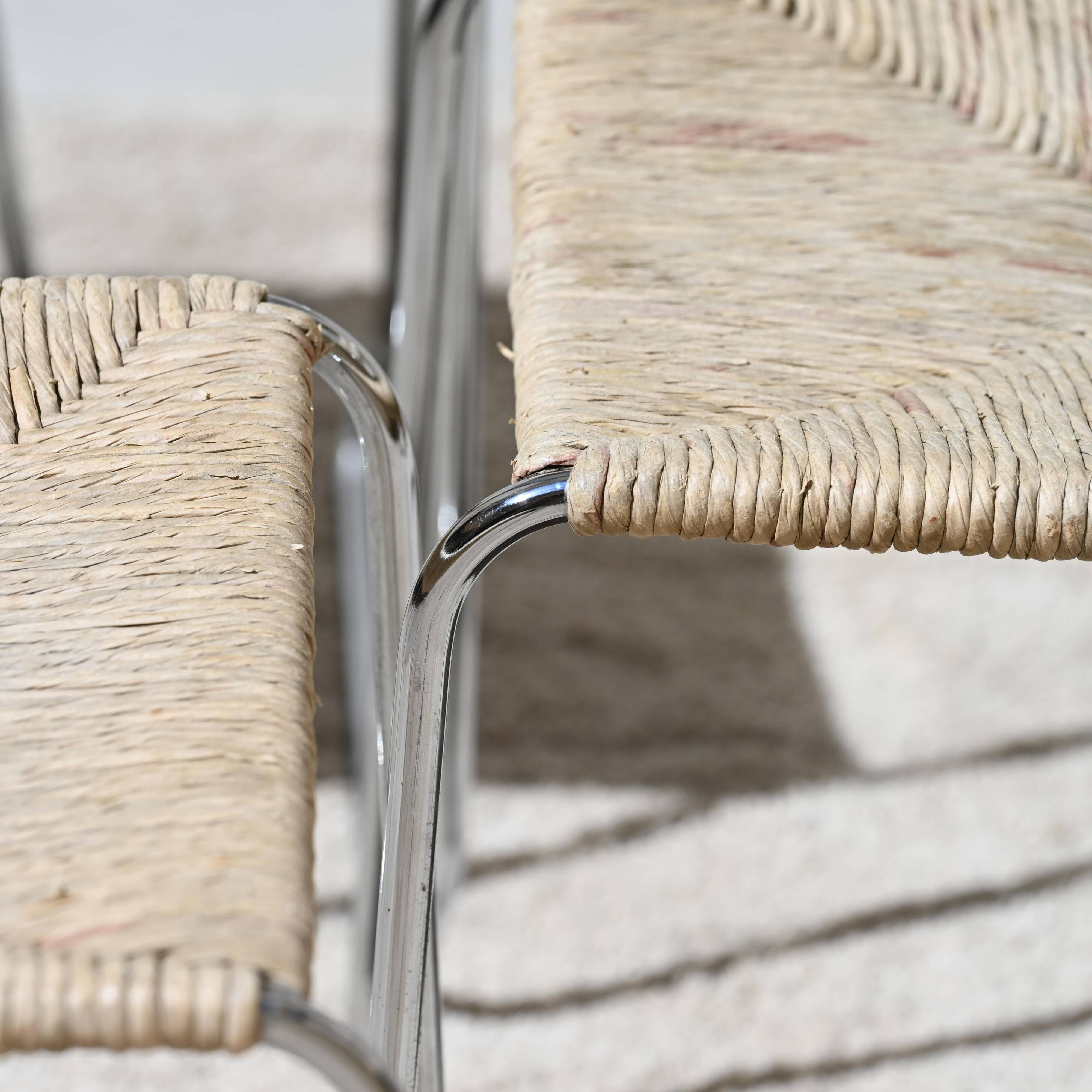 Four straw-seated chairs from 1980.