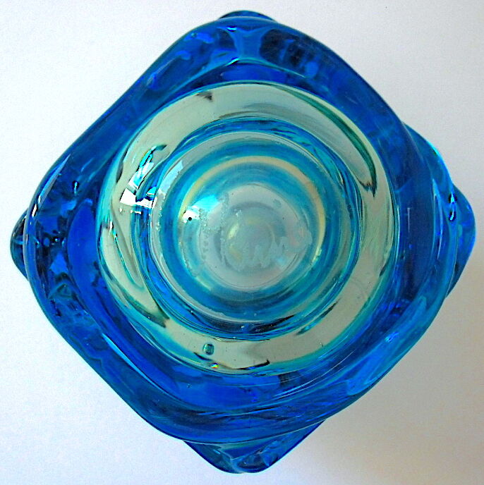 Blown blue glass bottle with inclusions