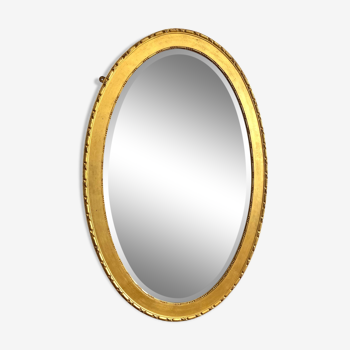 Miroir ovale XXème, trumeau en bois doré, glace biseautée, miroir médaillon vintage