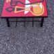 1970s design coffee table with ceramic and wood top, metal legs.