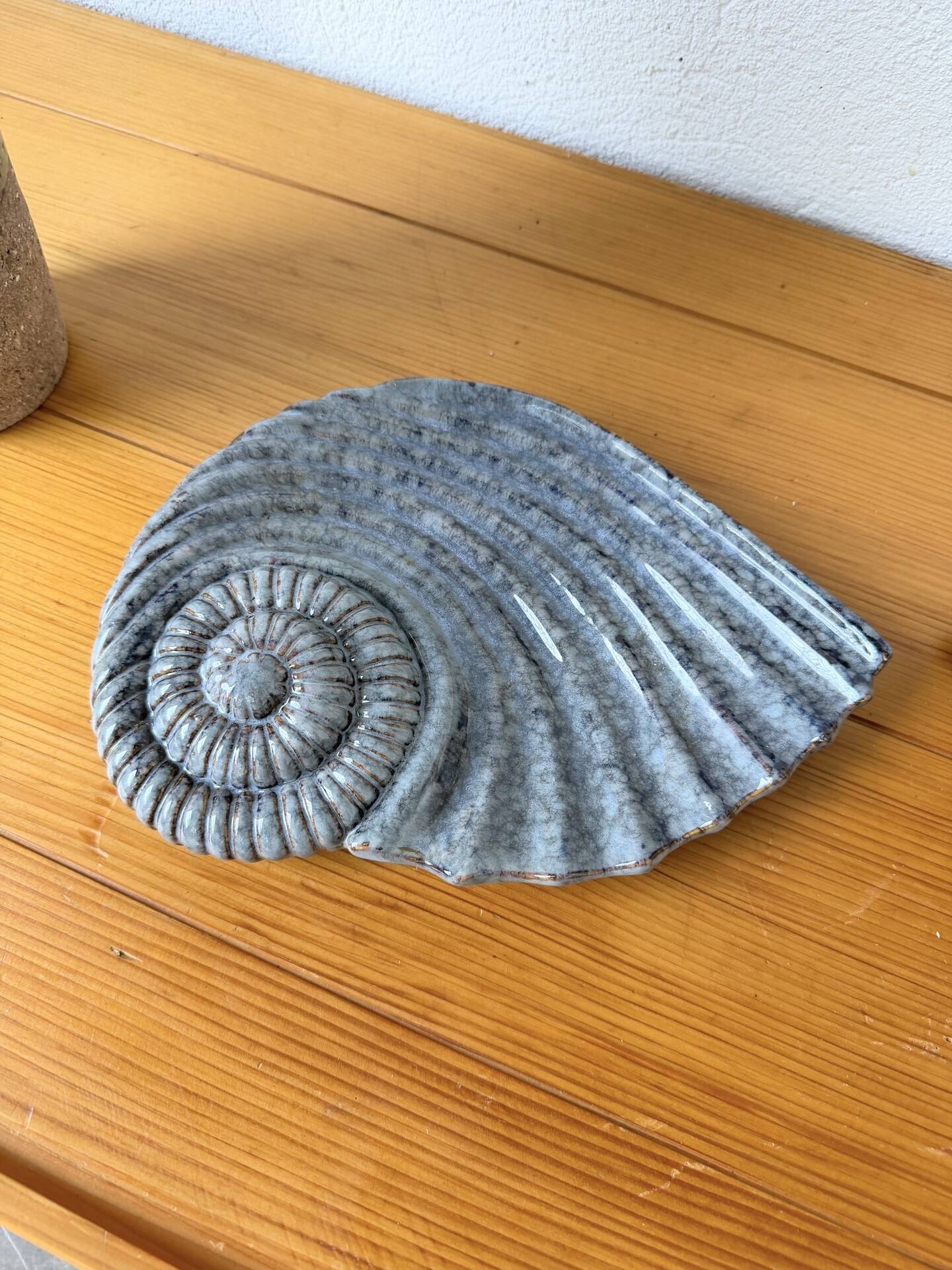 Shell-shaped ceramic catchall.