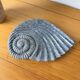 Shell-shaped ceramic catchall.