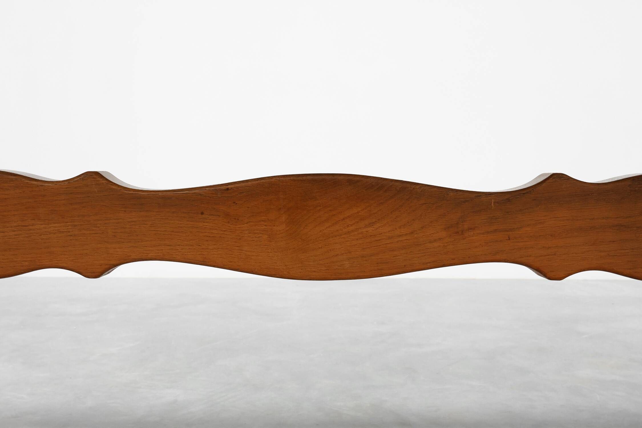 20th Century French oak trestle table with scalloped legs and plank top
