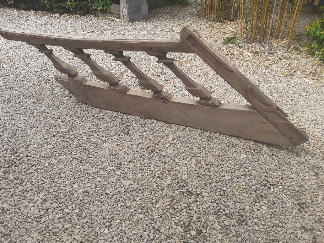 Old oak staircase balustrade with Louis XIII scrolled balusters