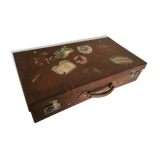 Suitcase of leather with labels of palaces