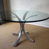 Round glass dining table, circa 1970.