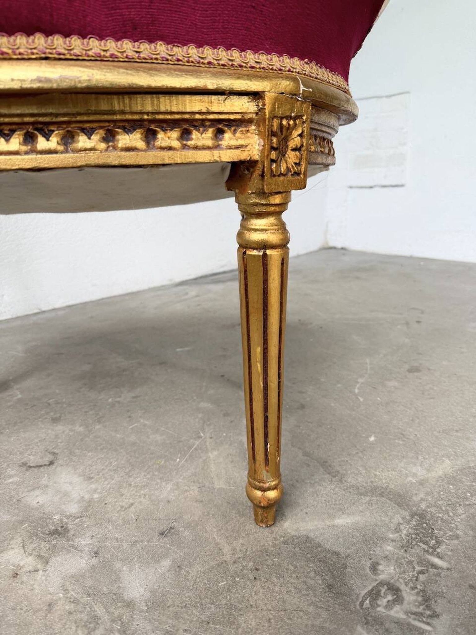 Louis XVI gilt wood and red velvet armchair