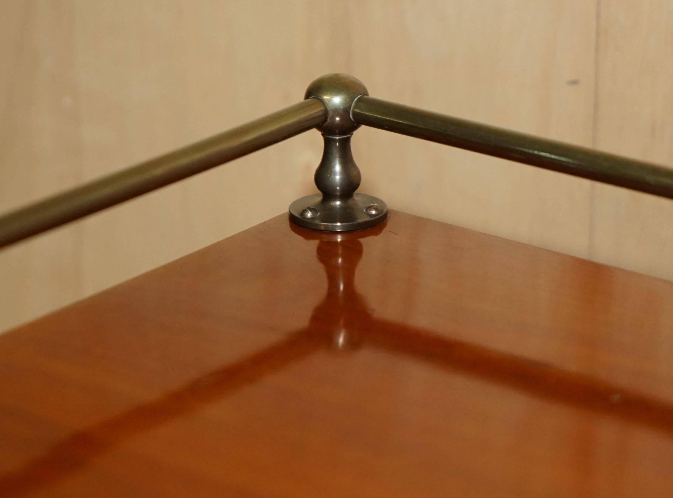 Victorian high chest of drawers in walnut with a bronze gallery.