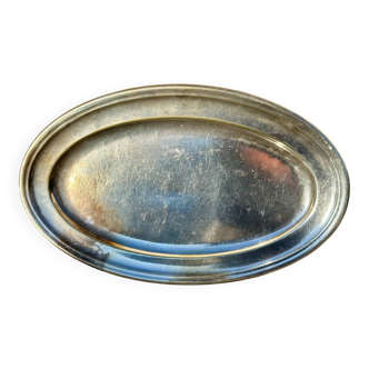Old beautiful oval plate in white metal silverware.