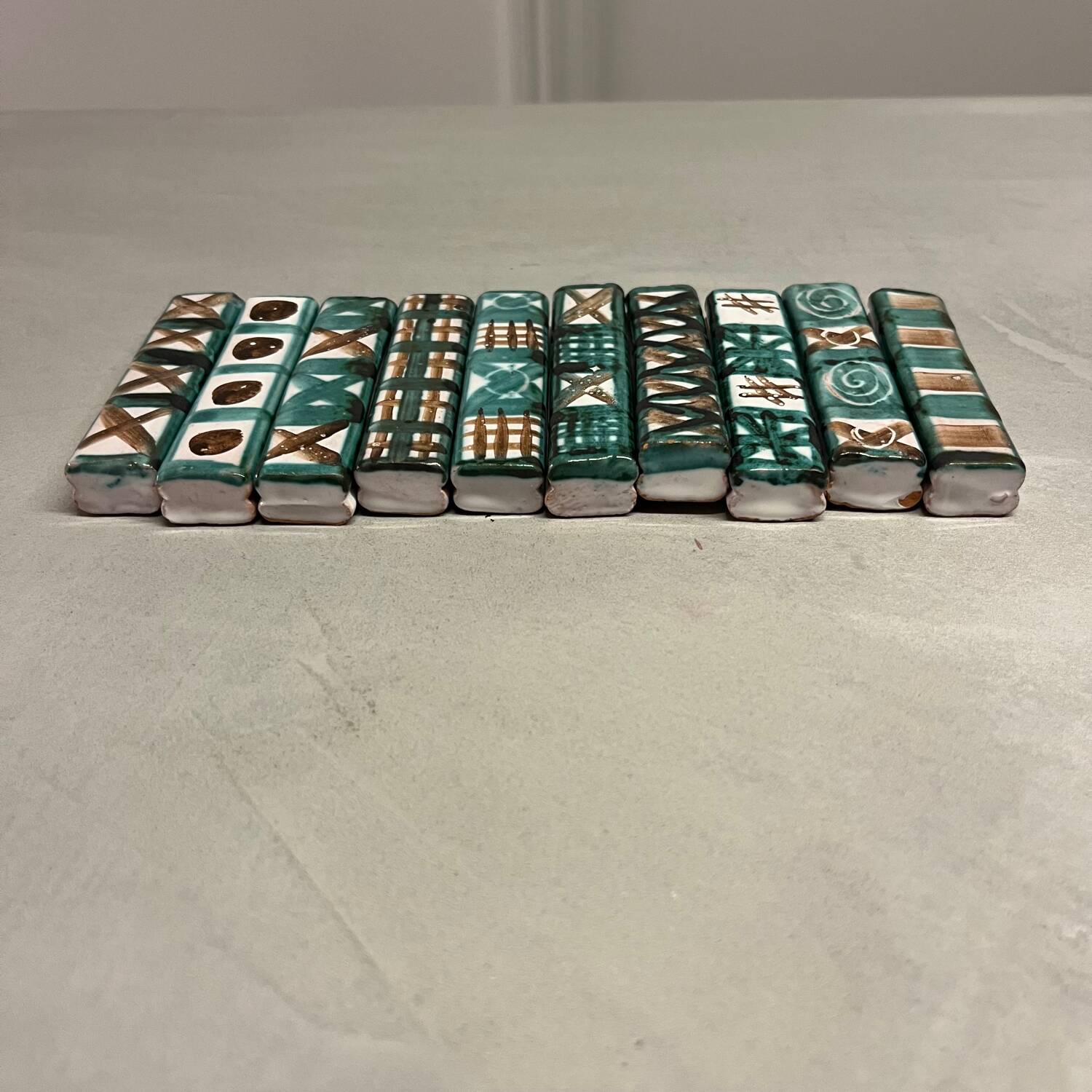 Set of 10 knife rests by Robert Picault