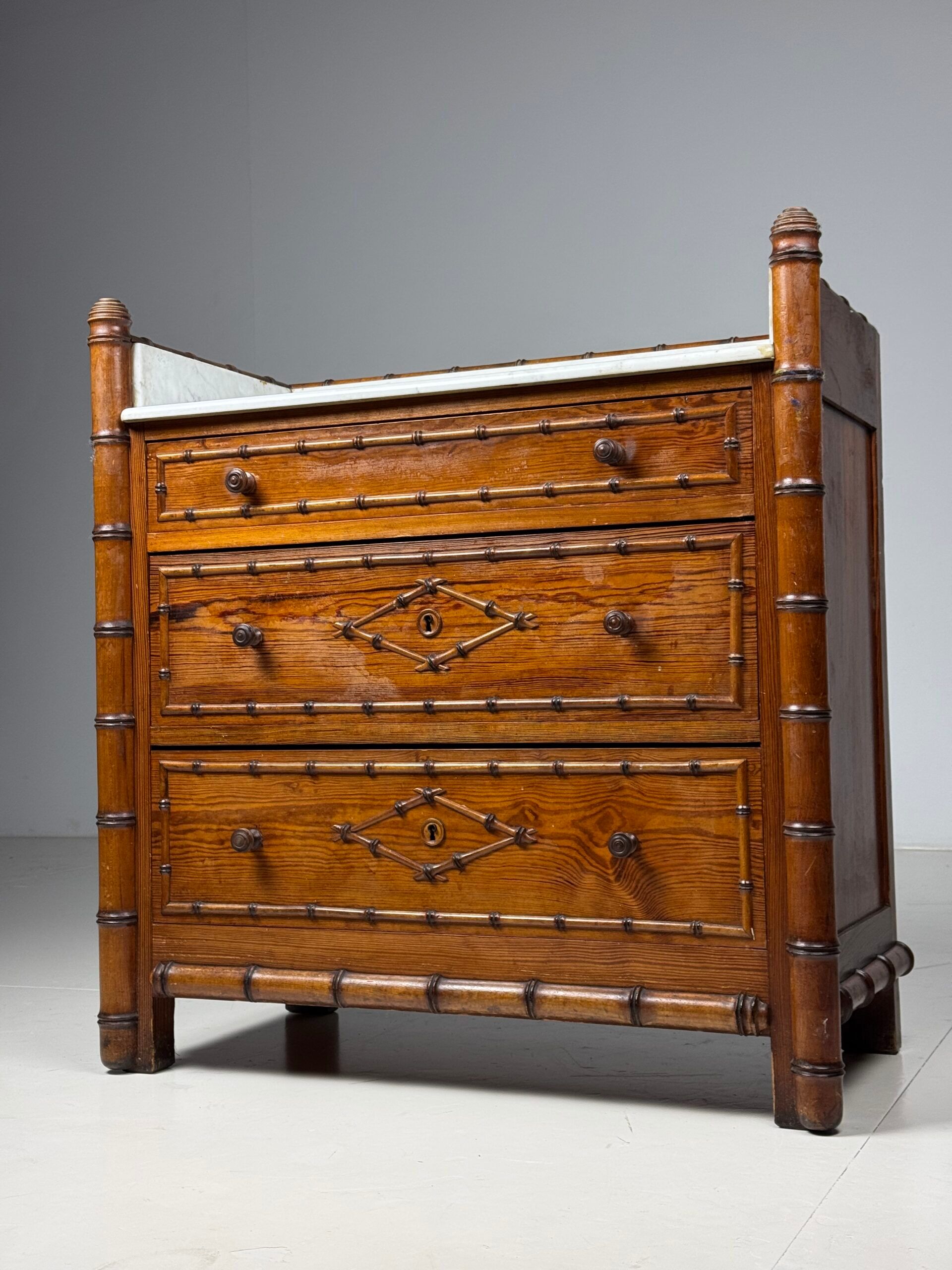 Faux bamboo chest of drawers 1900