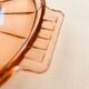 Round pink molded glass tray