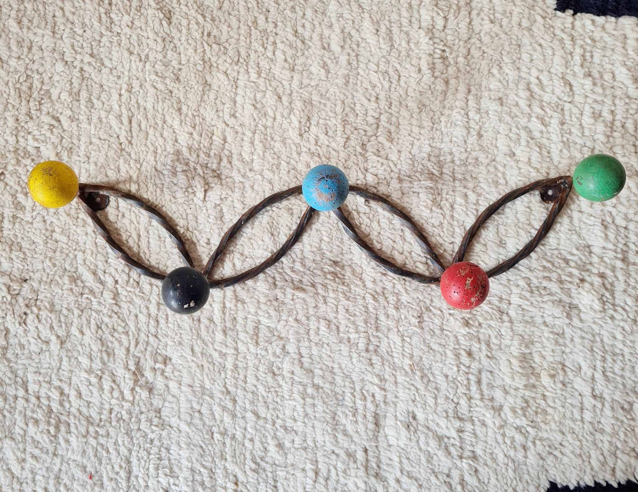 Vintage wall-mounted coat rack in wrought iron with coloured balls - Roger Feraud