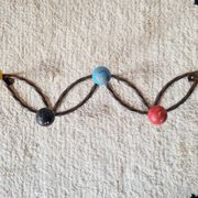 Vintage wall-mounted coat rack in wrought iron with coloured balls - Roger Feraud