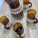 Carafe and glasses in amber glass and rattan