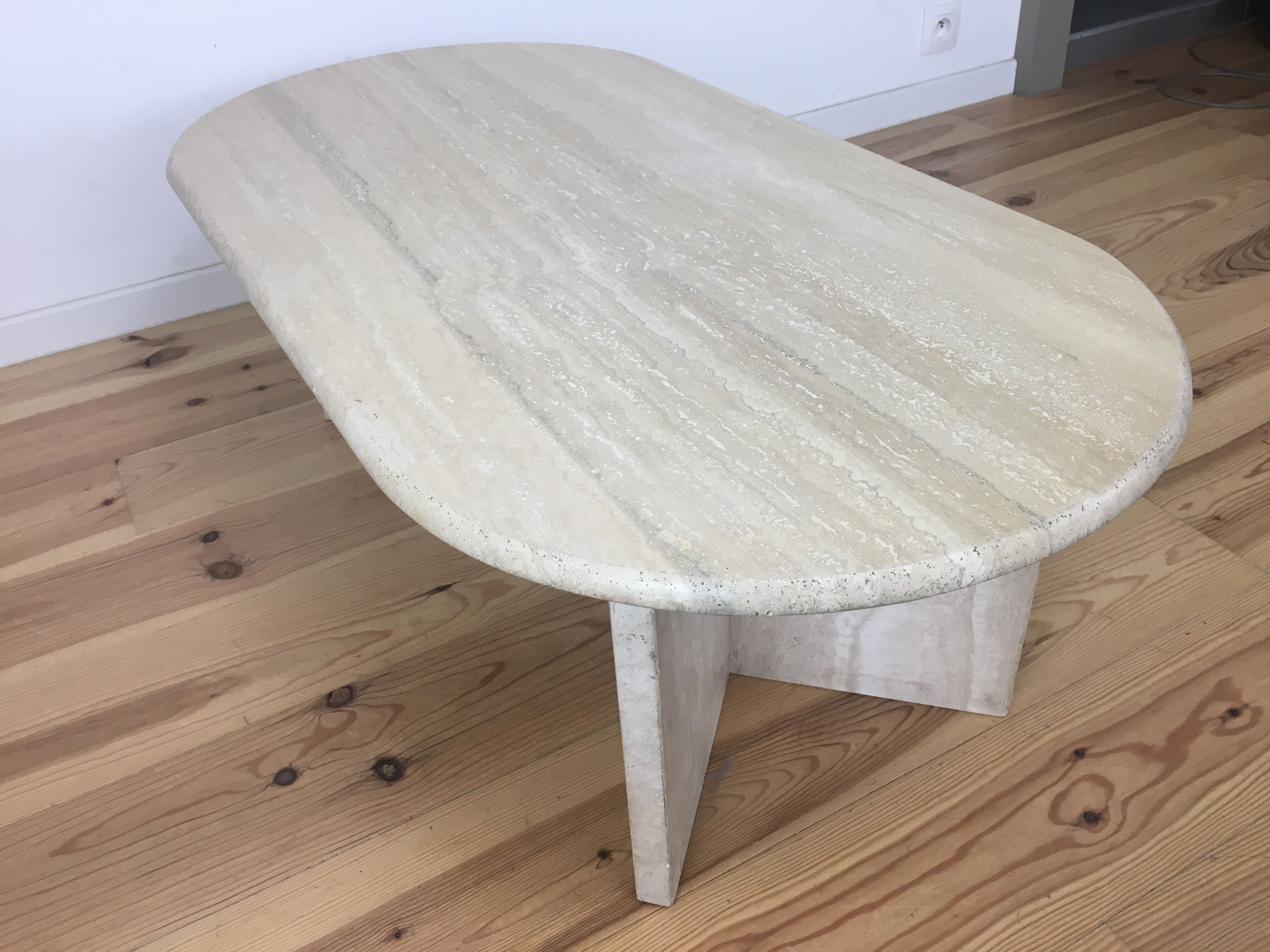 Oval coffee table in travertine