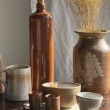 Large antique stoneware bottle with a small cork stopper