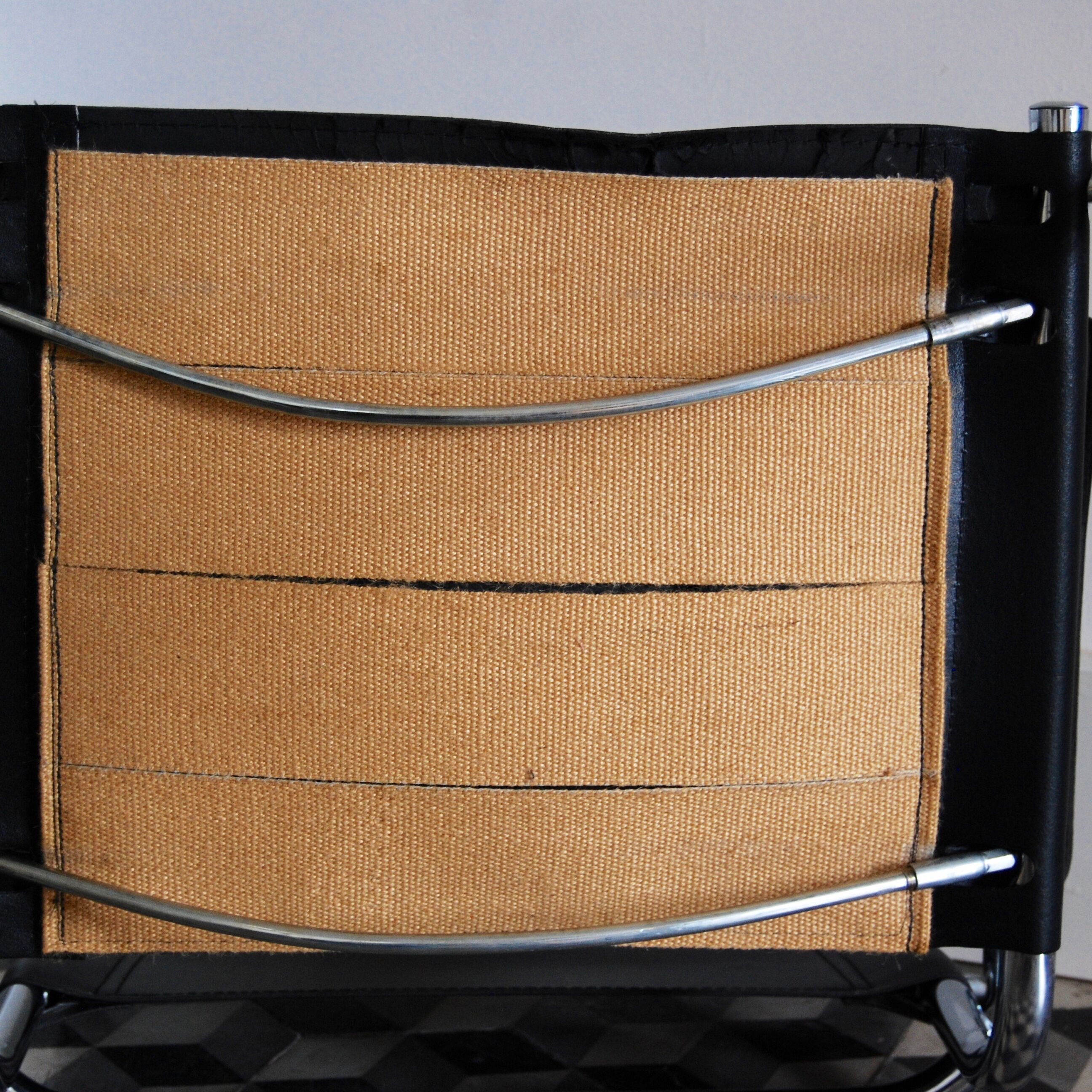 Vintage chrome and faux black leather armchair