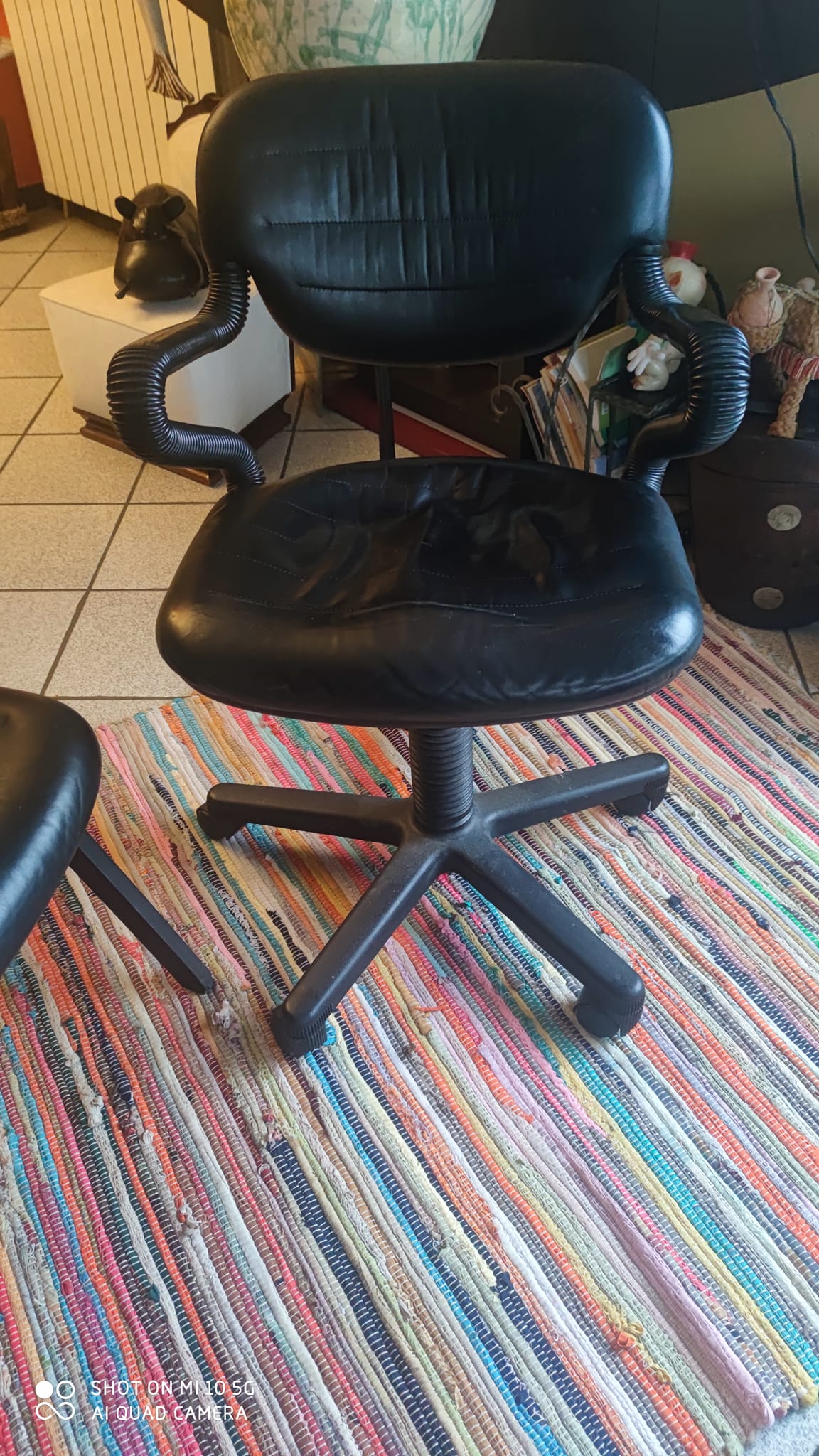 Two black leather armchairs
