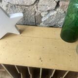 On a piece of furniture with sorting lockers and drawers