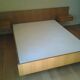 Bed with integrated bedside tables