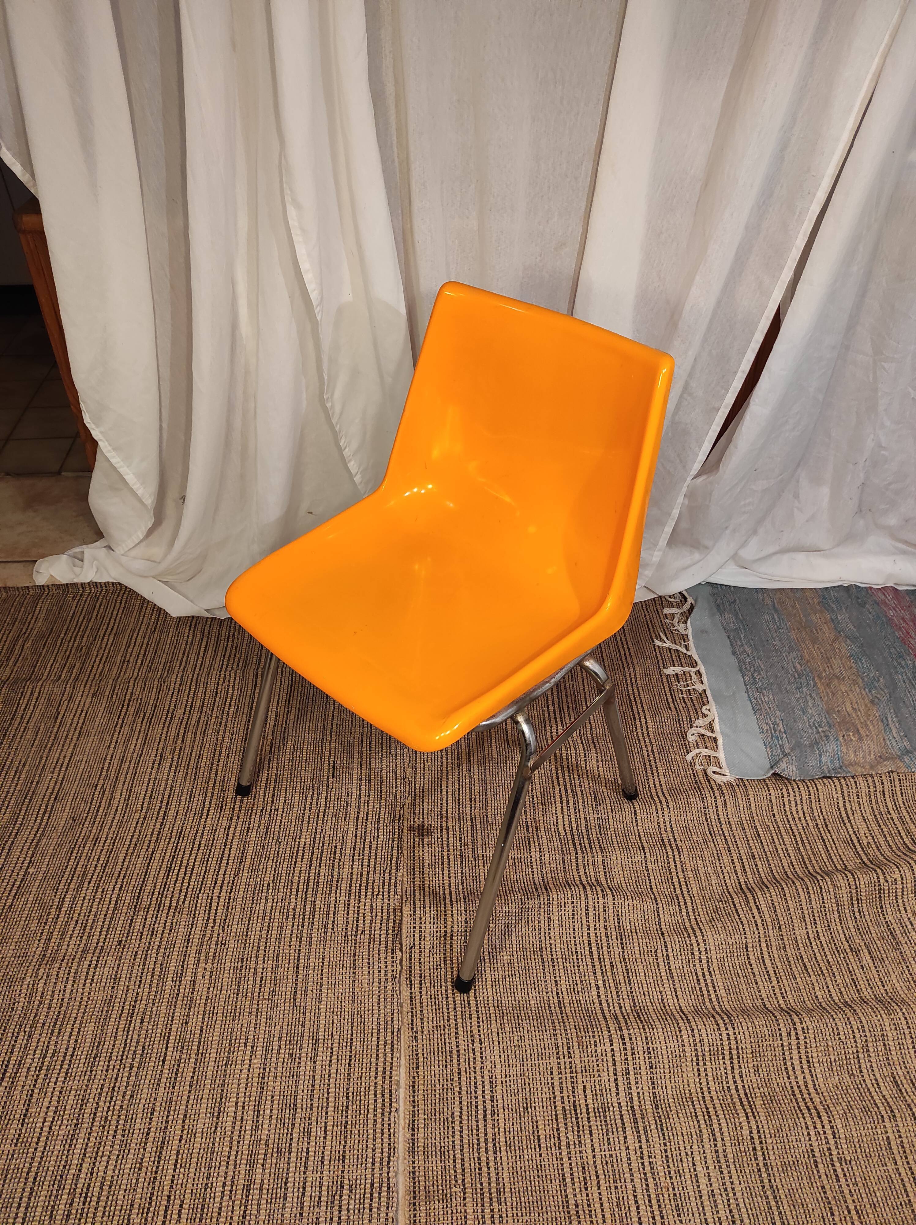 Orange plastic chair 1970