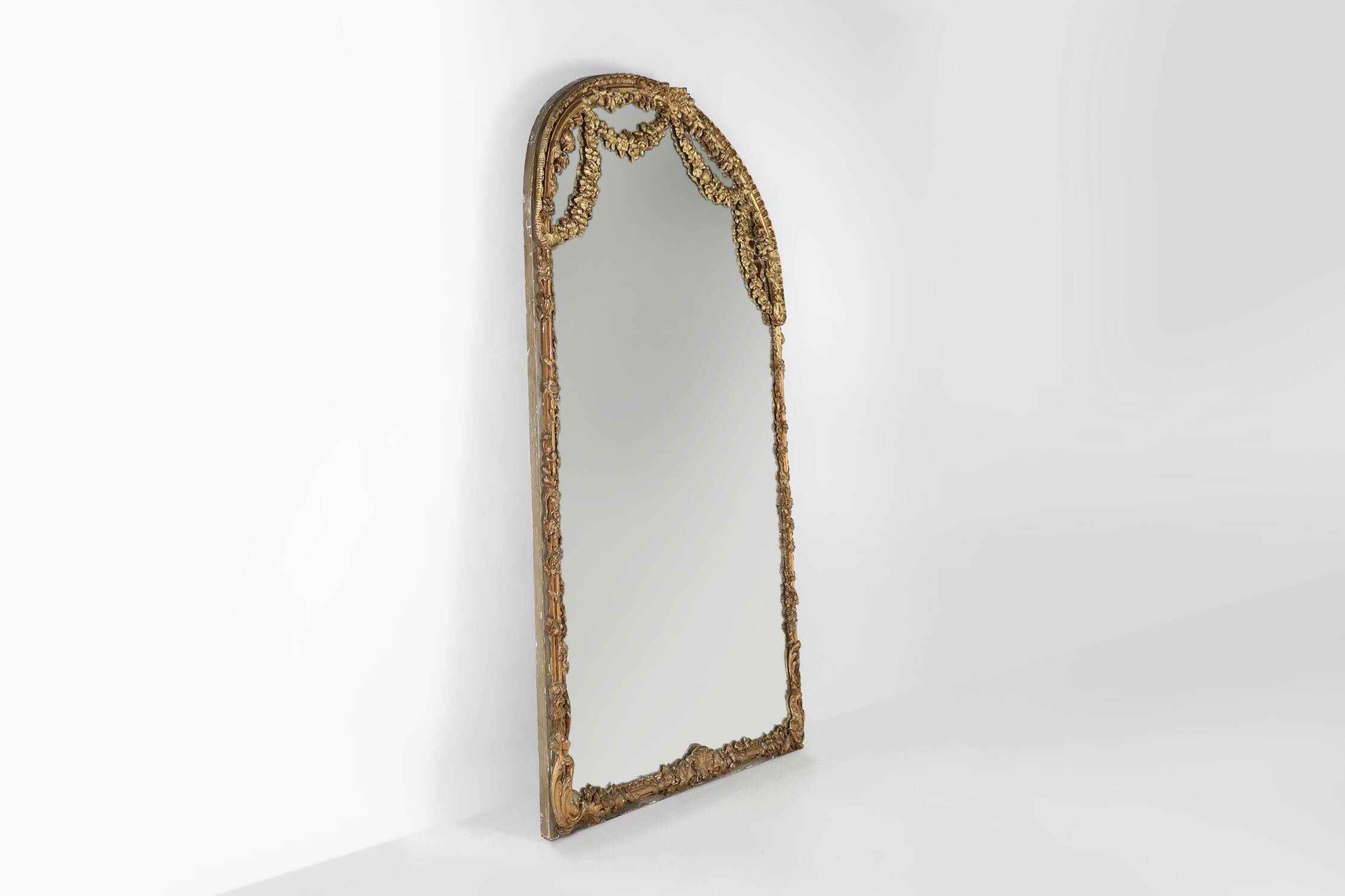Large baroque decorated chimney mirror in gilted wood, France ca. 1800