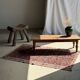 Brown Indonesian teak coffee table, with a border and cylindrical legs H40 L103.