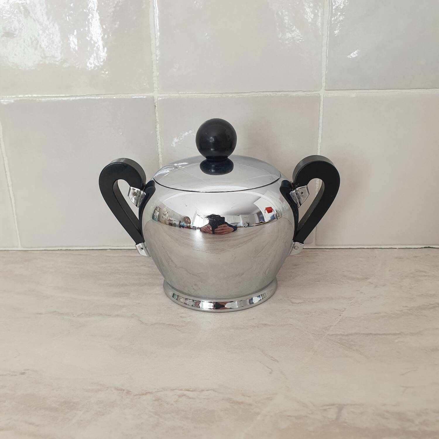 Alessi / Stainless steel and bakelite sugar bowl, "Bombé" collection