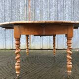 Round table in solid cherry wood, extendable with twisted legs, Louis Philippe style.