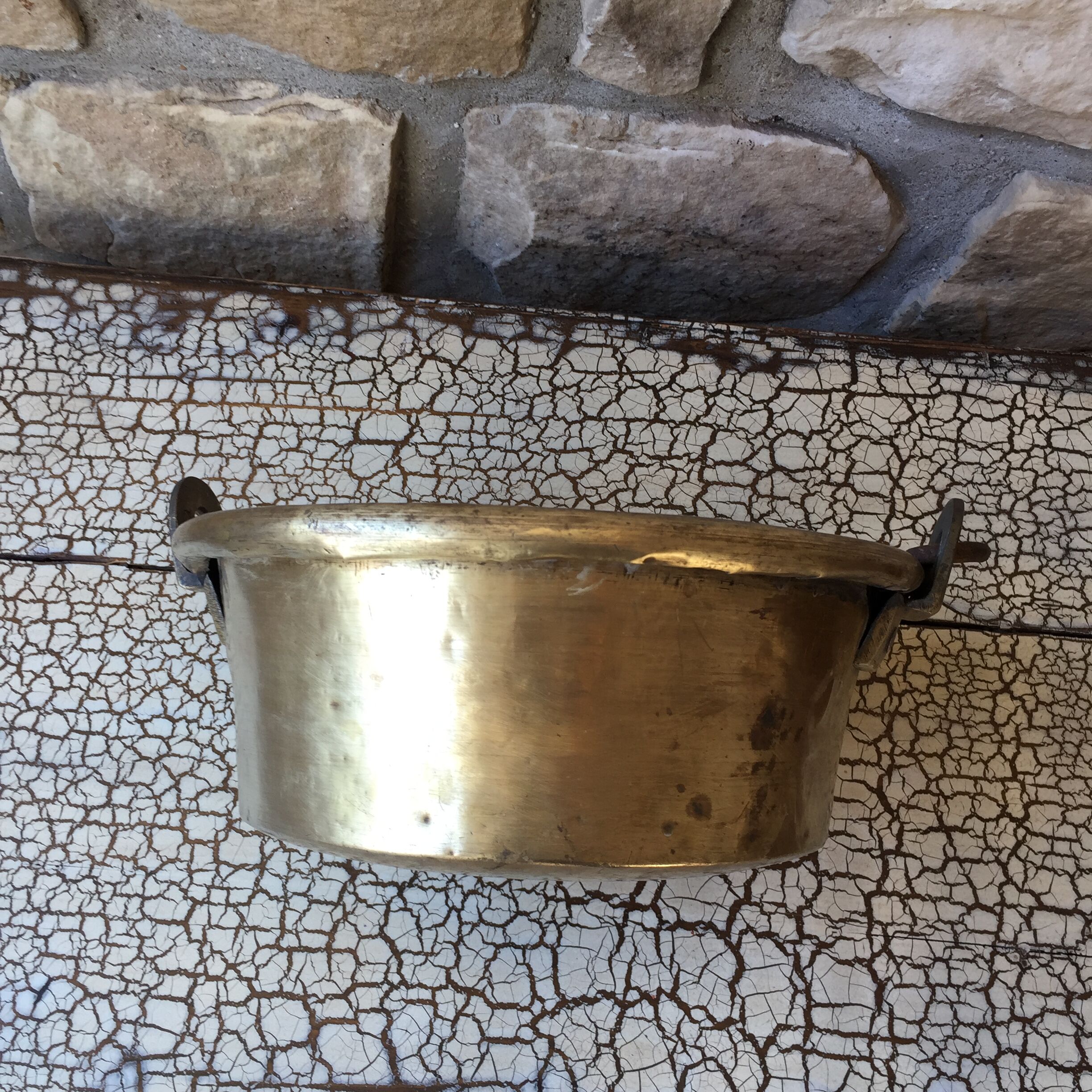 Basin cauldron or old garden in yellow copper