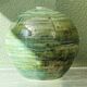 Glazed ceramic ball lamp base, green gradients.