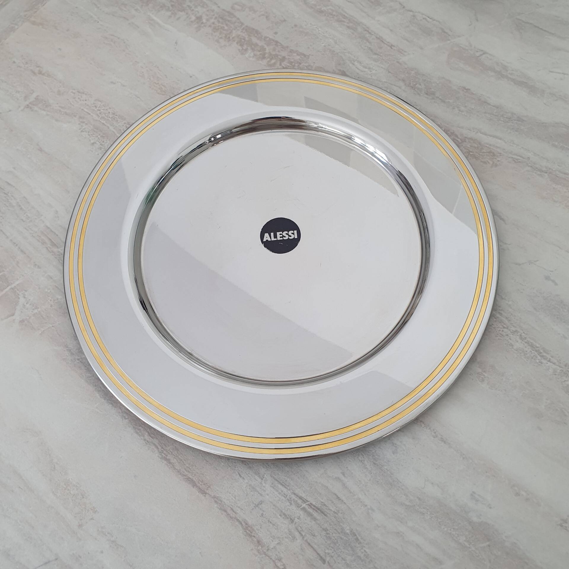 Alessi Ettore Sottsass / Serving plate in stainless steel 18/10 and gold NG5100