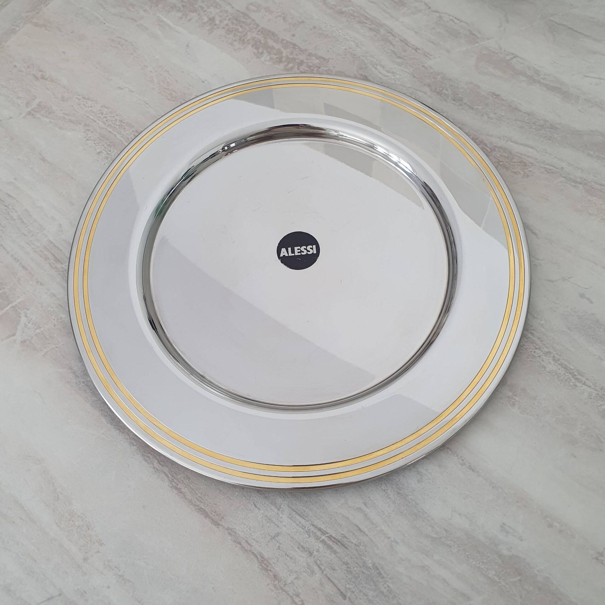 Alessi Ettore Sottsass / Serving plate in stainless steel 18/10 and gold NG5100