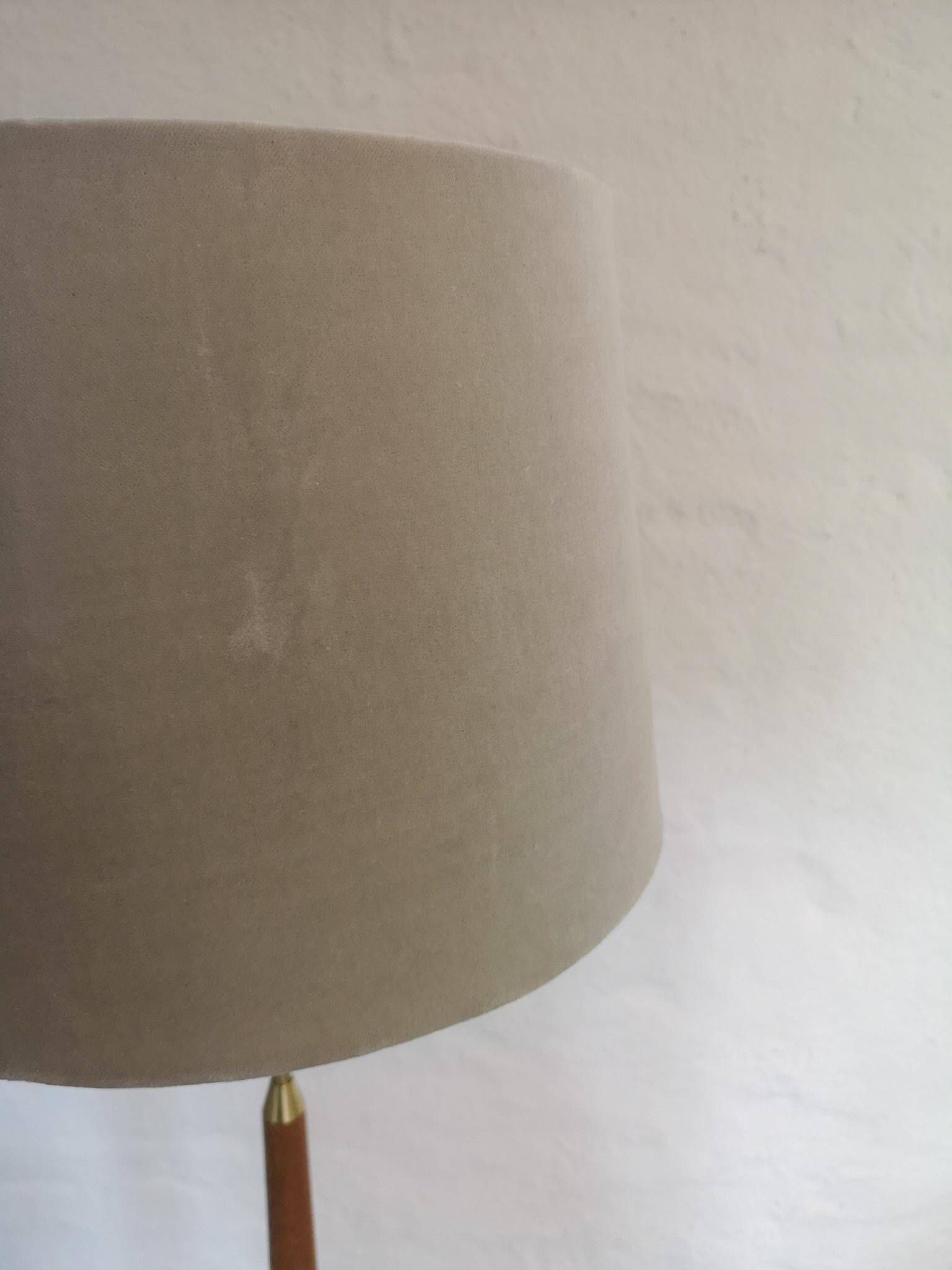 Mid-century floor lamp in teak and brass by Falkenbergs Belysning, Sweden, 1960s.