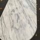 Oval bistro table in marble and petrol black steel, seats 4, 140cm