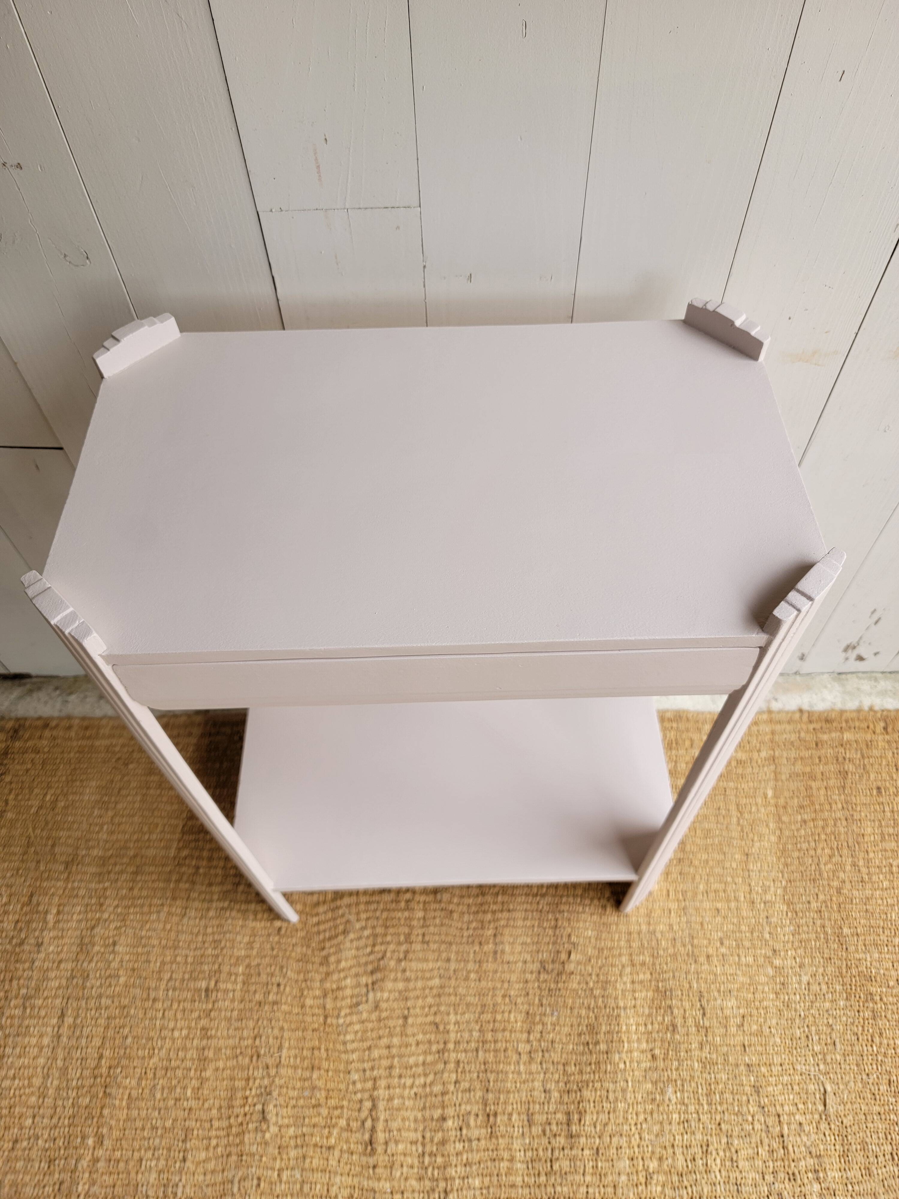 Small renovated Art Deco console in nude colour.