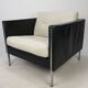 Pair of armchairs by Pierre Paulin for Artifort, black leather and cream fabric.