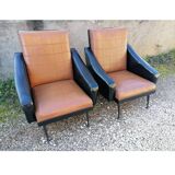 Paire de fauteuils en simili cuir