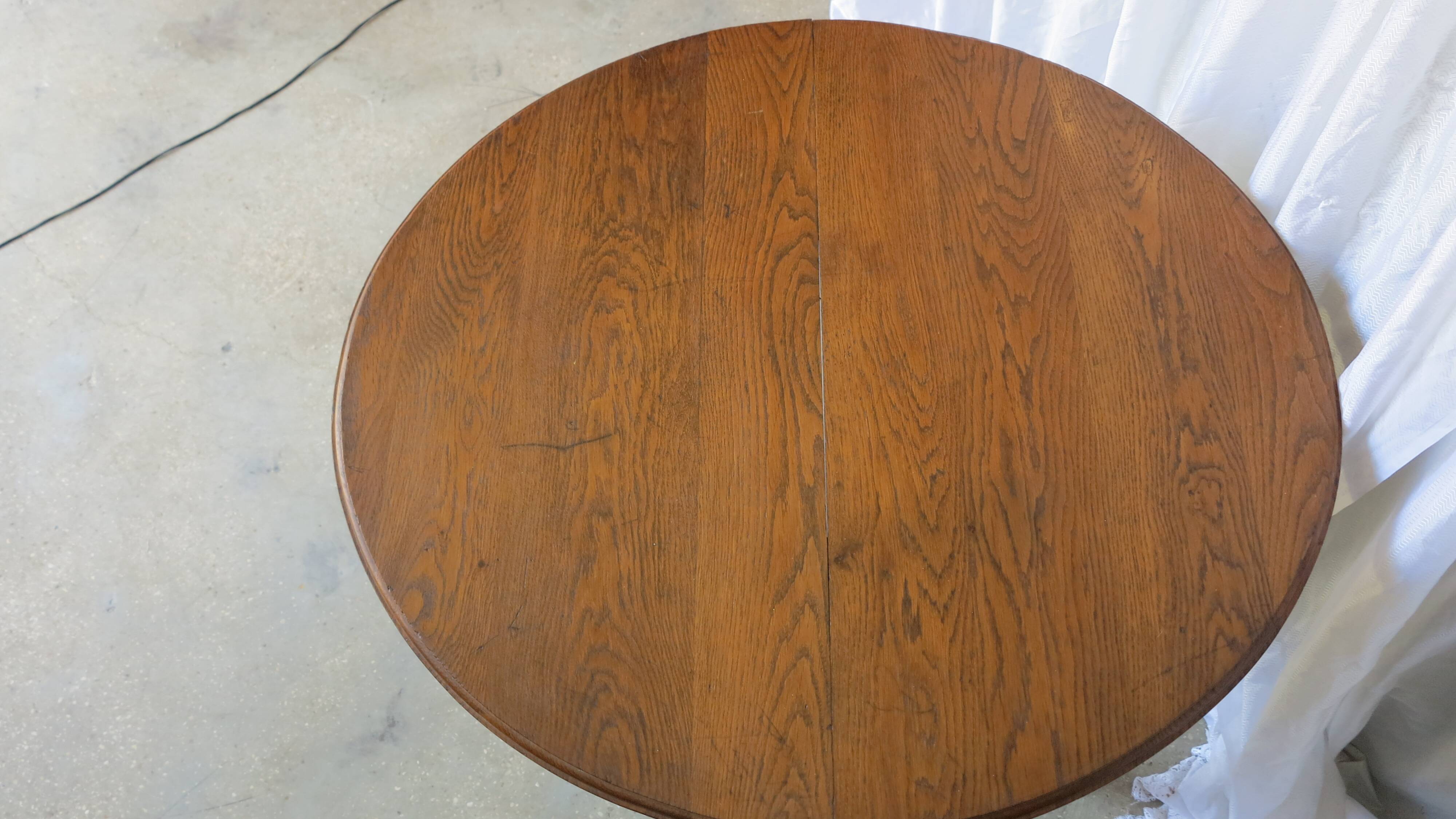 1930s oak dining table, slightly oval.