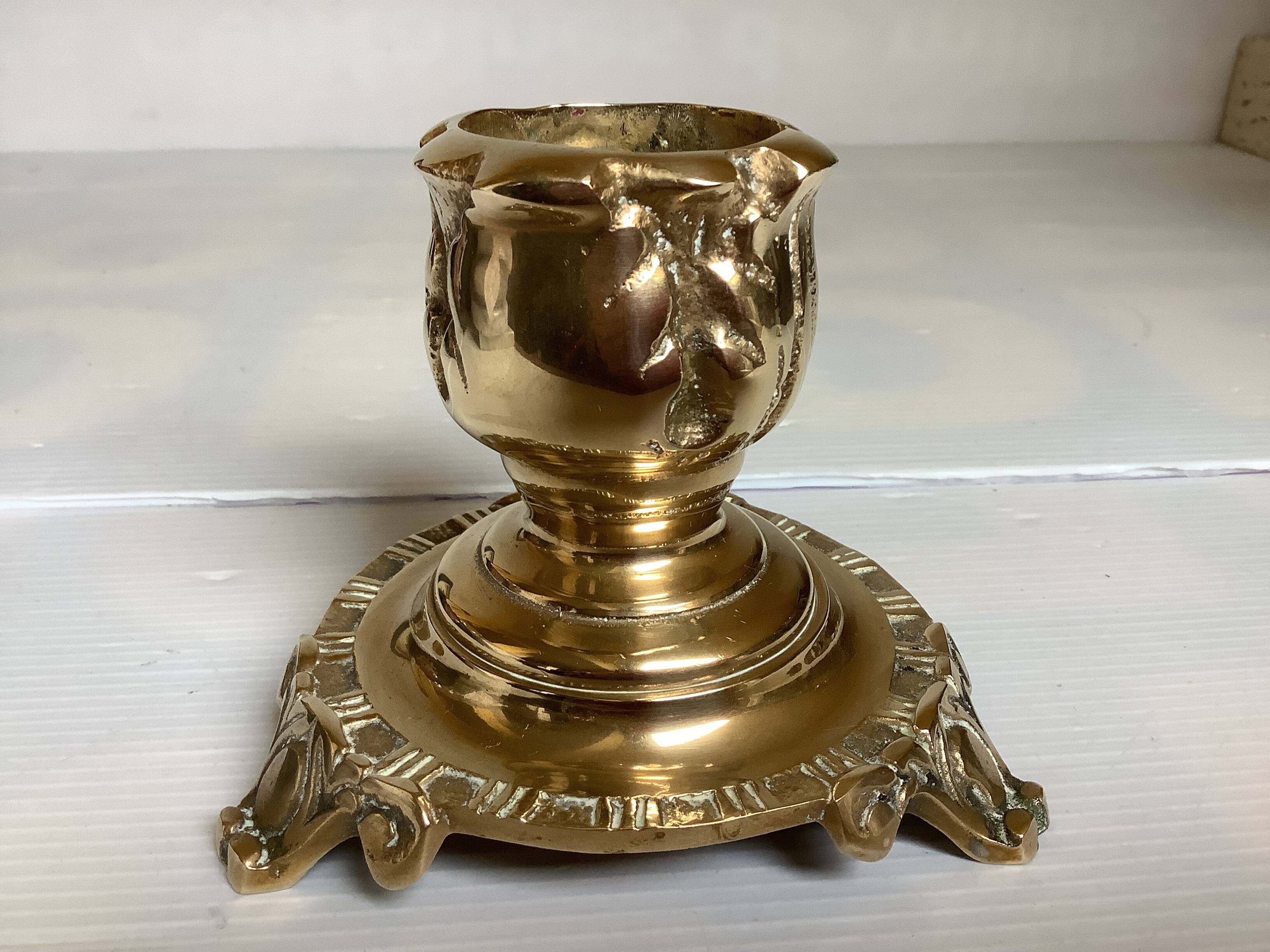 Tripod candlestick in worked bronze