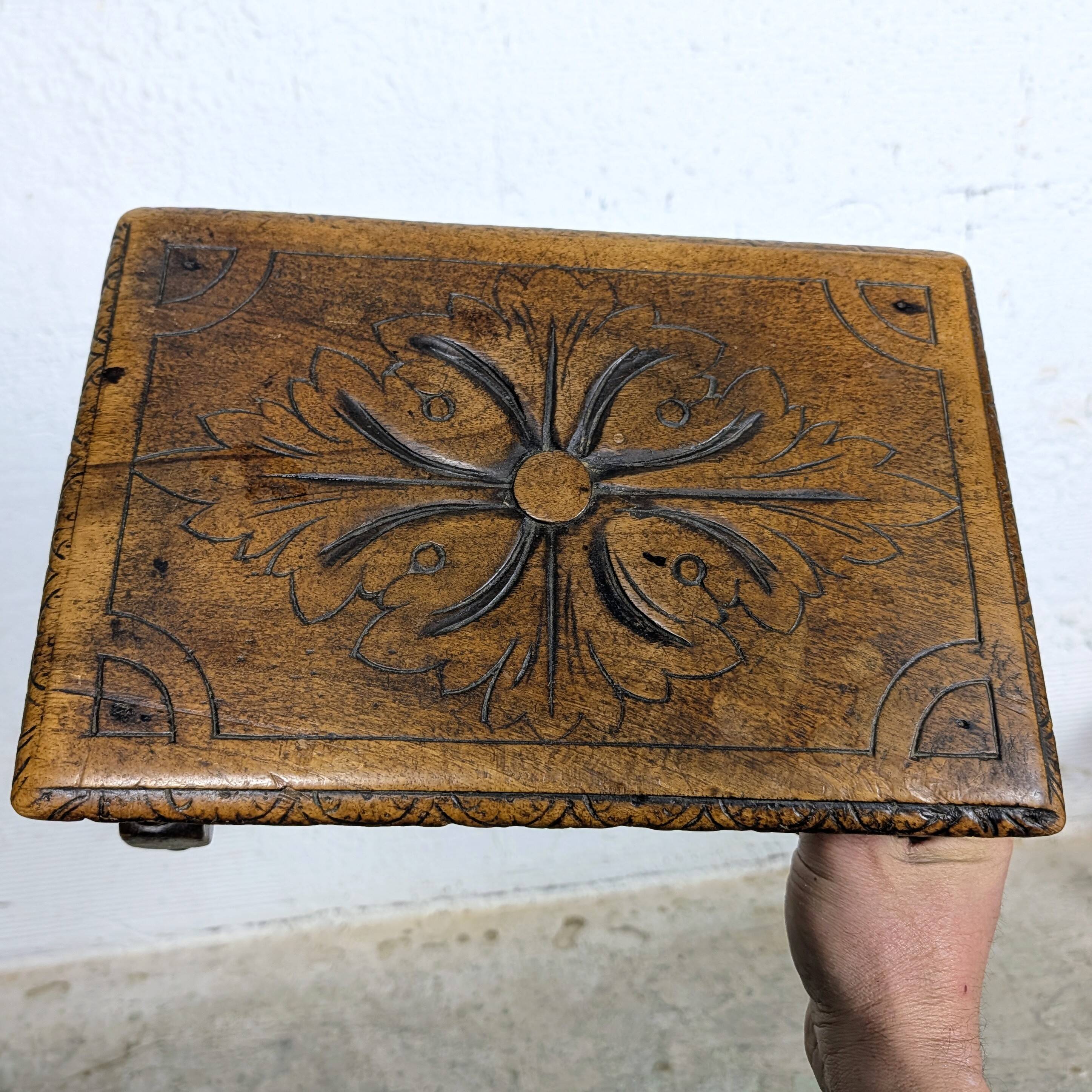 Carved wooden footrest