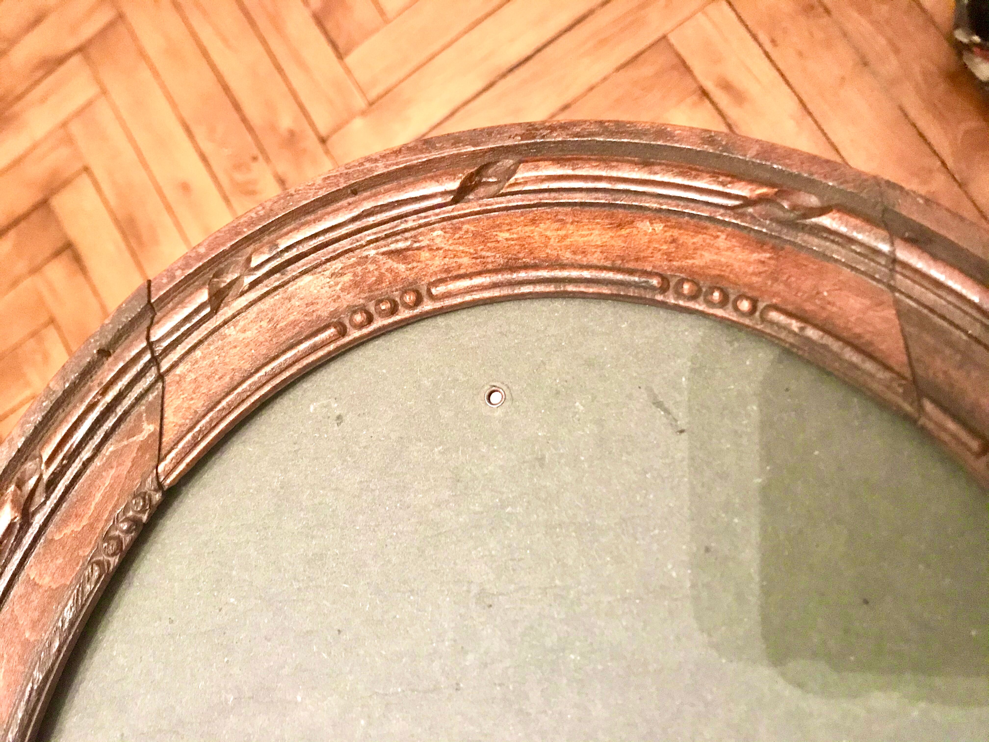 Carved wood oval frame
