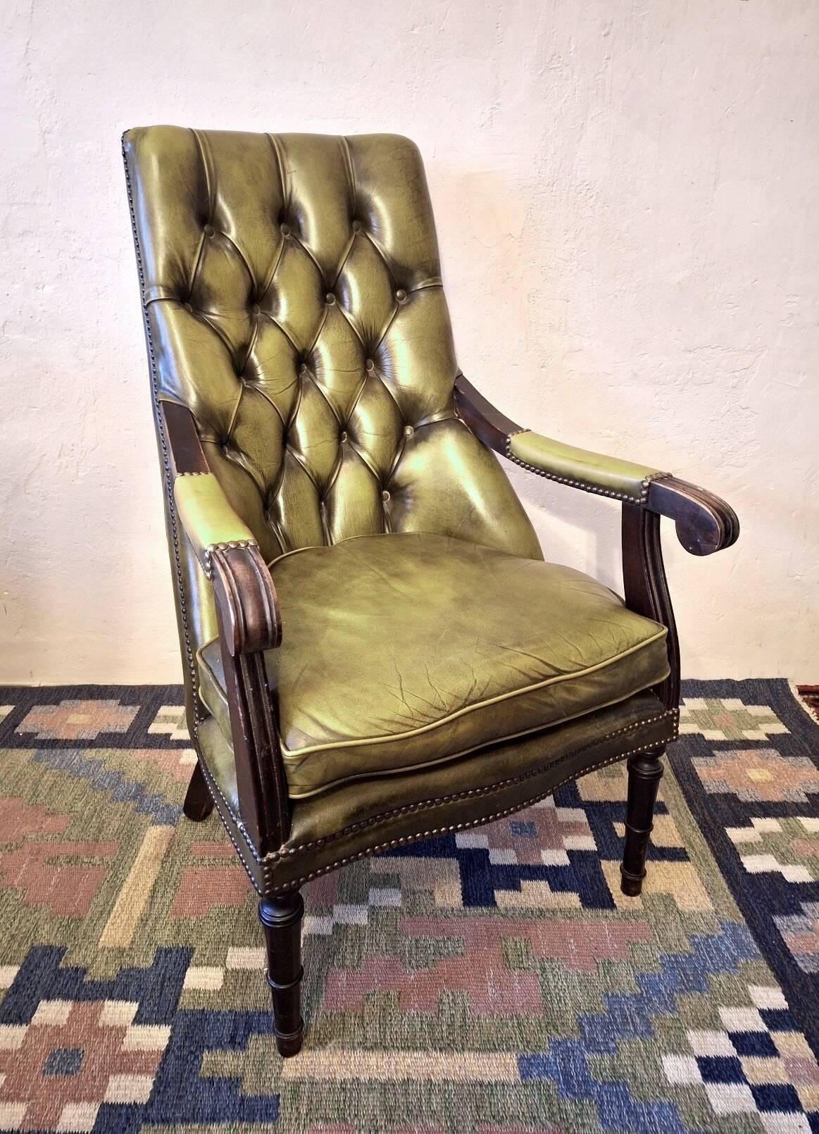 Olive green tufted leather library armchair, 1970s