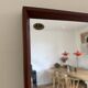 Beautiful vintage Danish teak mirror with mittered edges and nice brass det