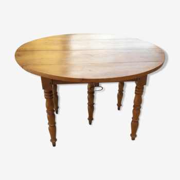 Ancienne table ronde à rallonges a 5 pieds en merisier massif